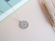 Silver weight plate pendant on silver chain